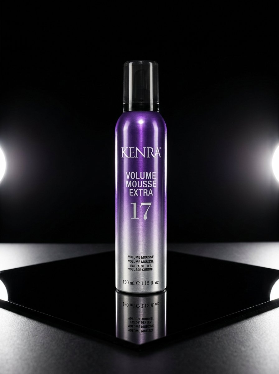 Purple and silver bottle of Kenra Volume Mousse Extra 17 standing on a reflective black surface.